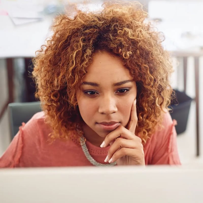 woman looking at laptop