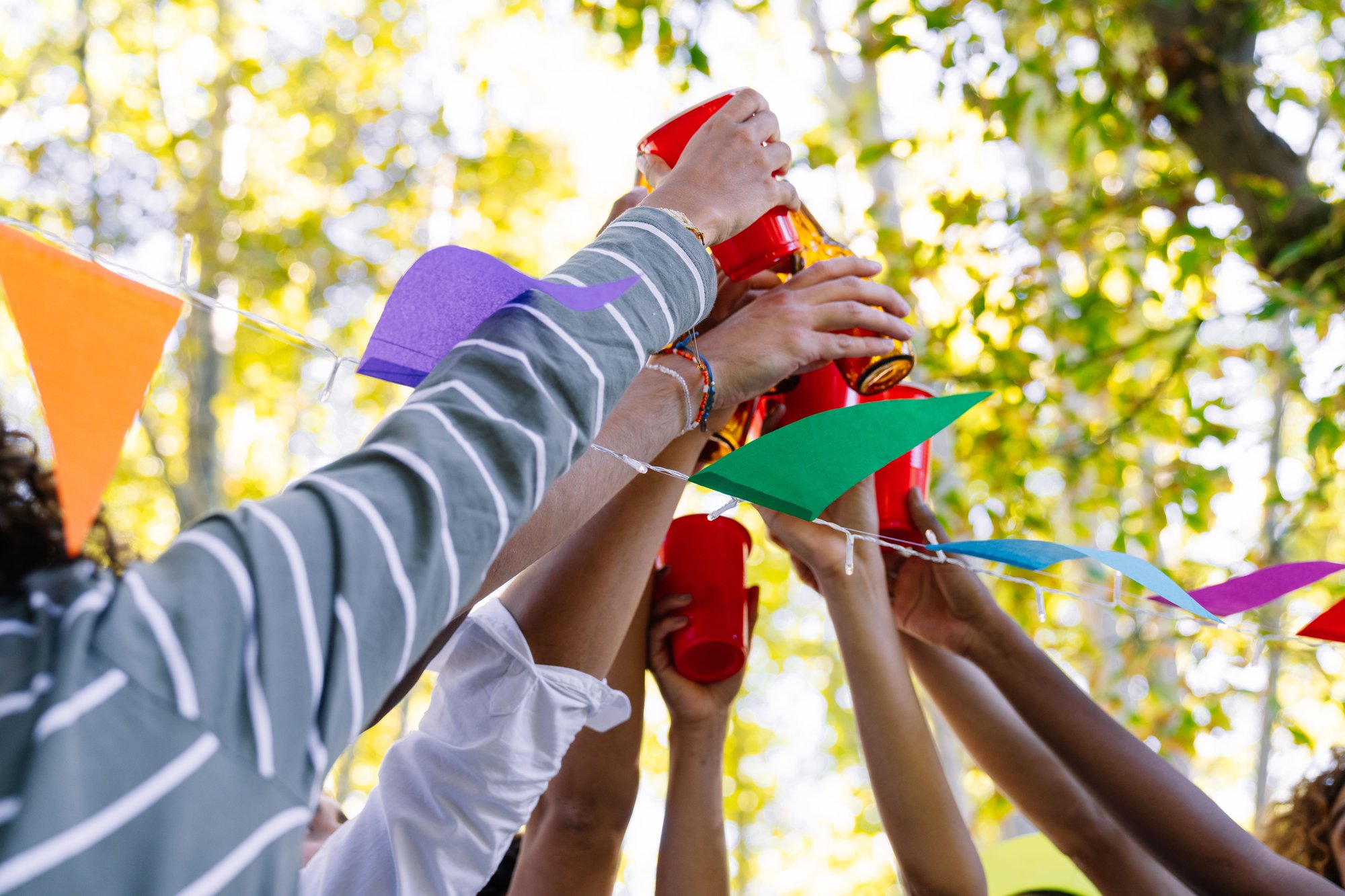 friends-toasting-with-drinks-at-outdoor-party-cele-2026-01-09-10-55-52-utc