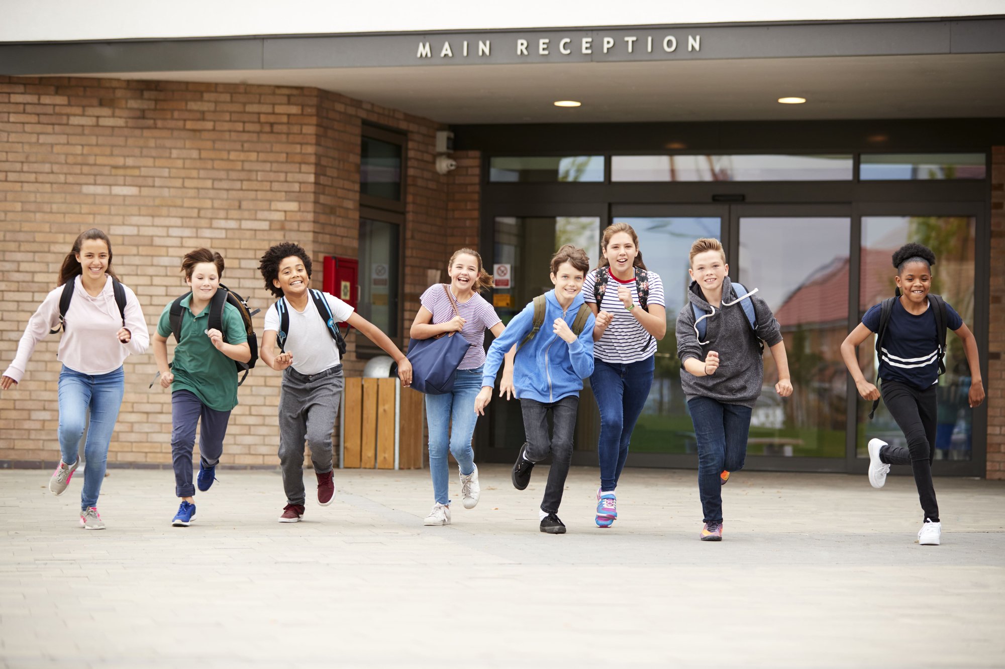 group-of-high-school-students-running-out-of-schoo-2026-03-10-03-16-41-utc