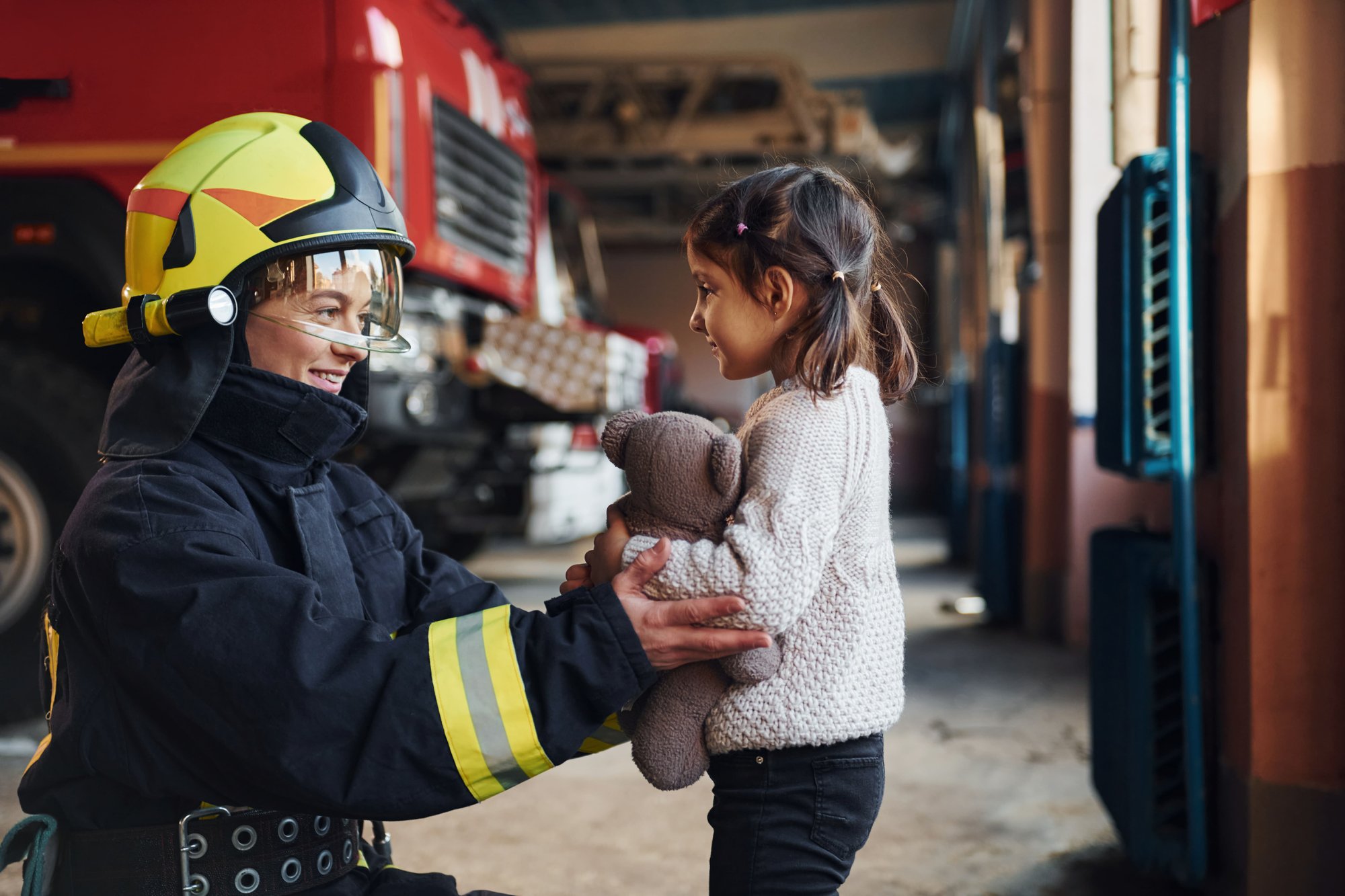 happy-little-girl-is-with-female-firefighter-in-pr-2026-01-09-00-08-45-utc