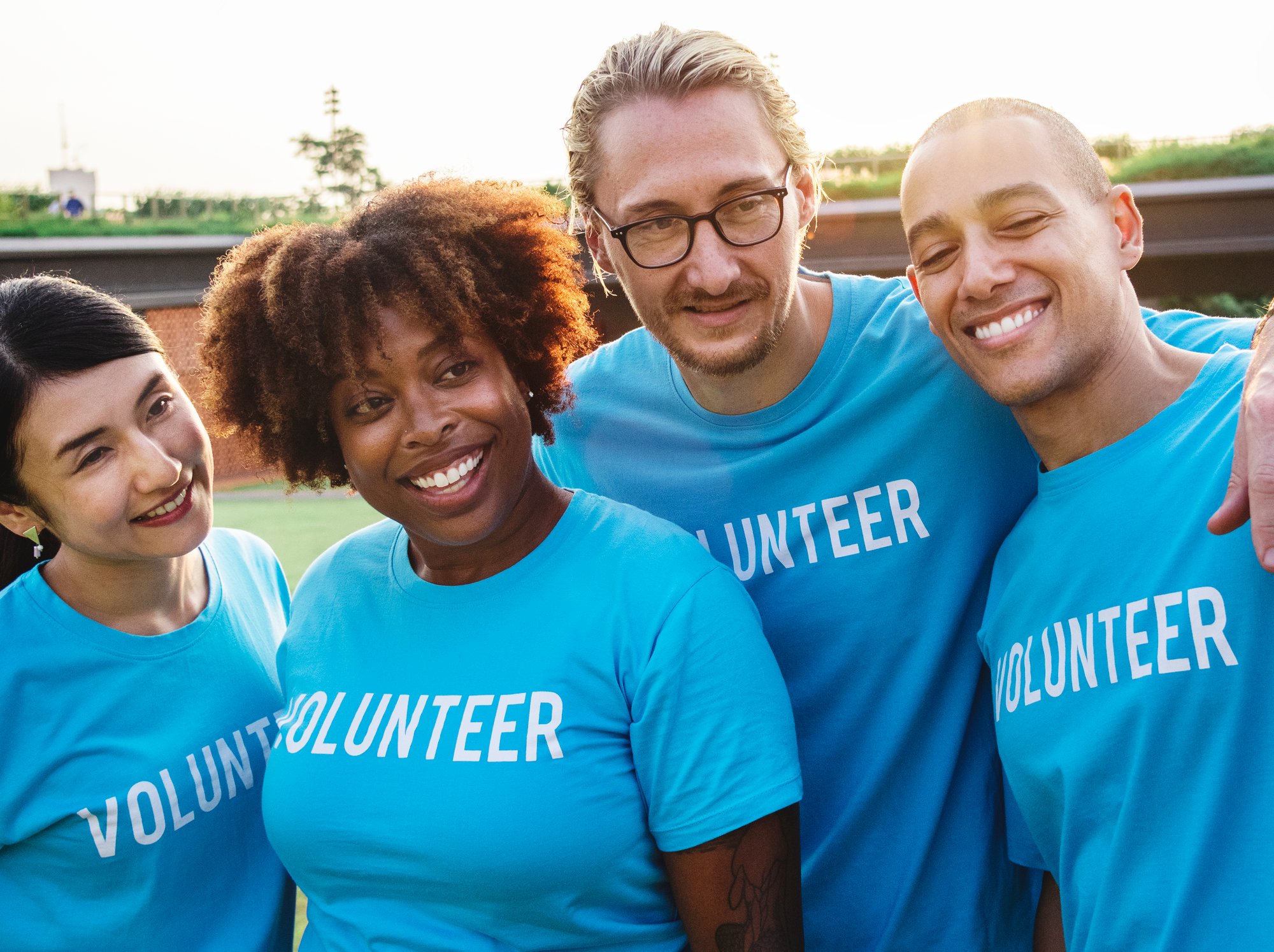 happy-volunteers-smiling-together-in-outdoor-setti-2026-01-07-23-59-20-utc