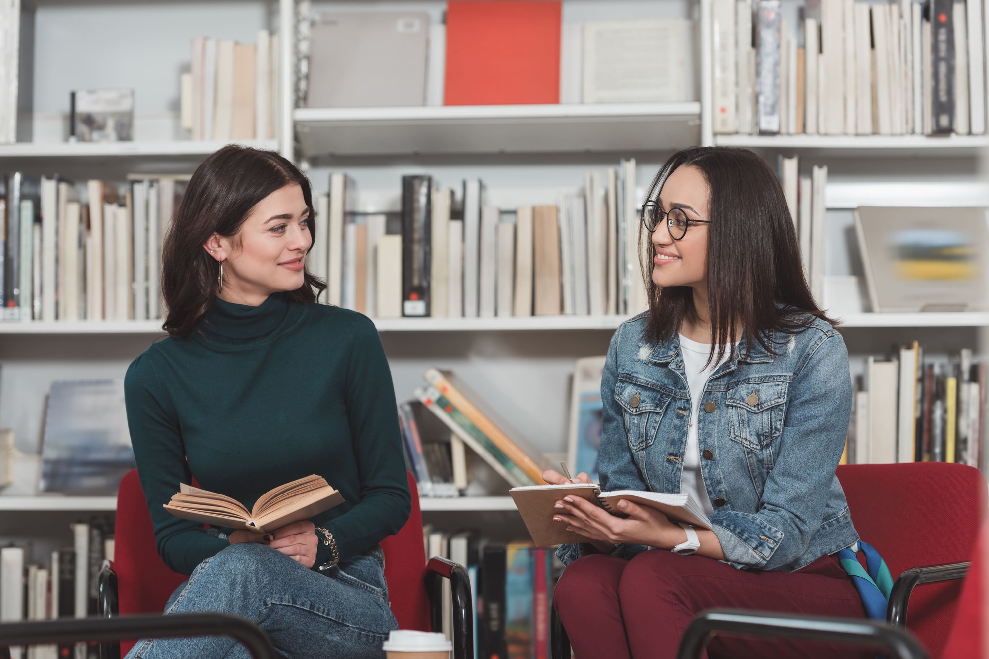 multicultural-friends-studying-together-in-library-2026-01-06-00-24-57-utc